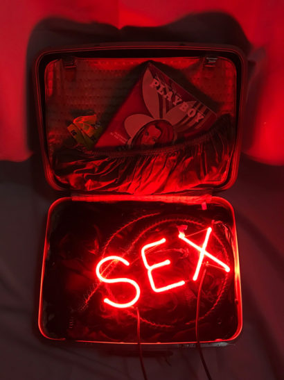 INDIRA-CESARINE_SEX-in-a-Suitcase_NEON-SCULPTURE-with-Vintage-Leather-Suitcase-Lingerie-Leather-Whip-June-1970-Issue-of-Playboy_2018-v2-lr.jpg